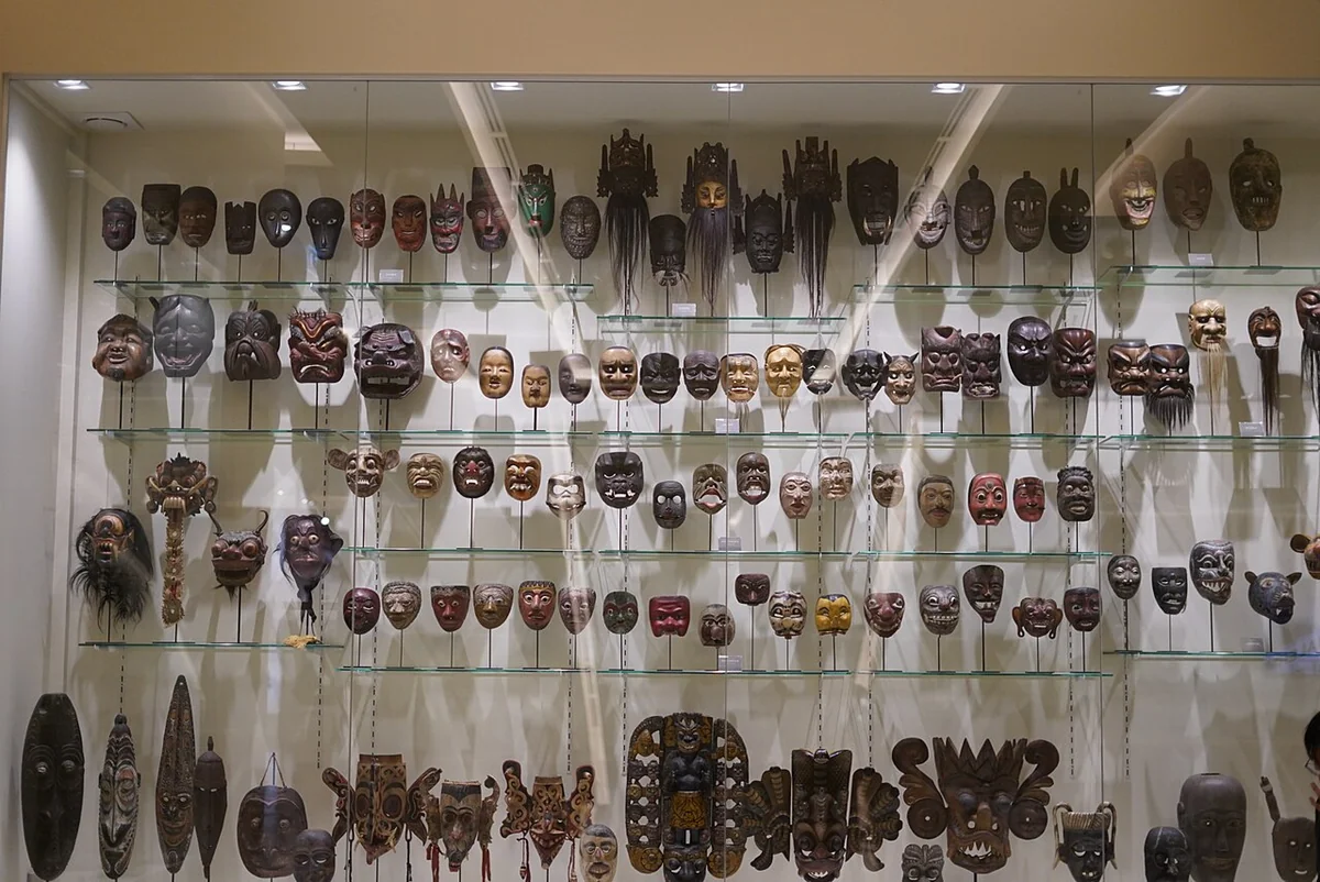 Display of traditional theatre masks inside MOCA Bangkok