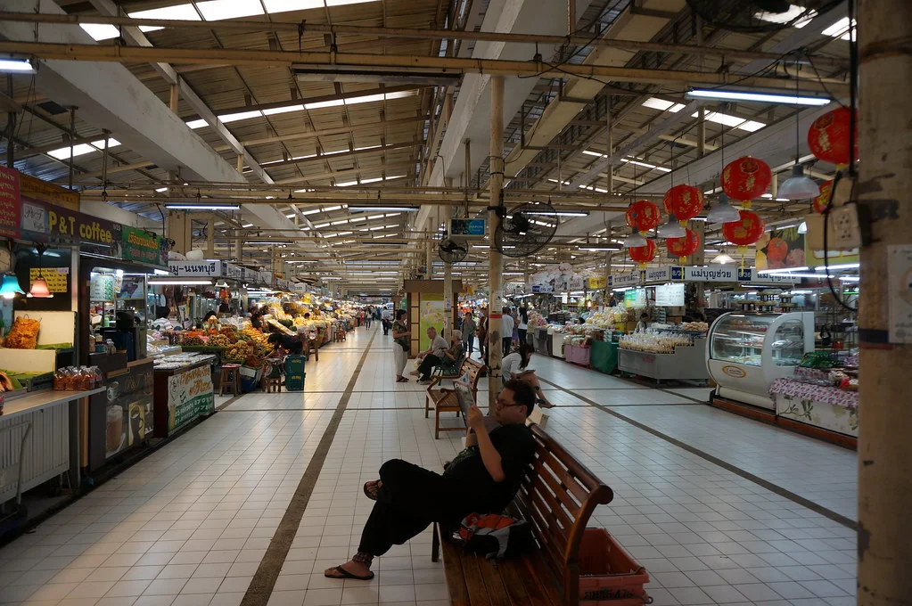 Covered aisles and food stalls inside Or Tor Kor Market in Bangkok