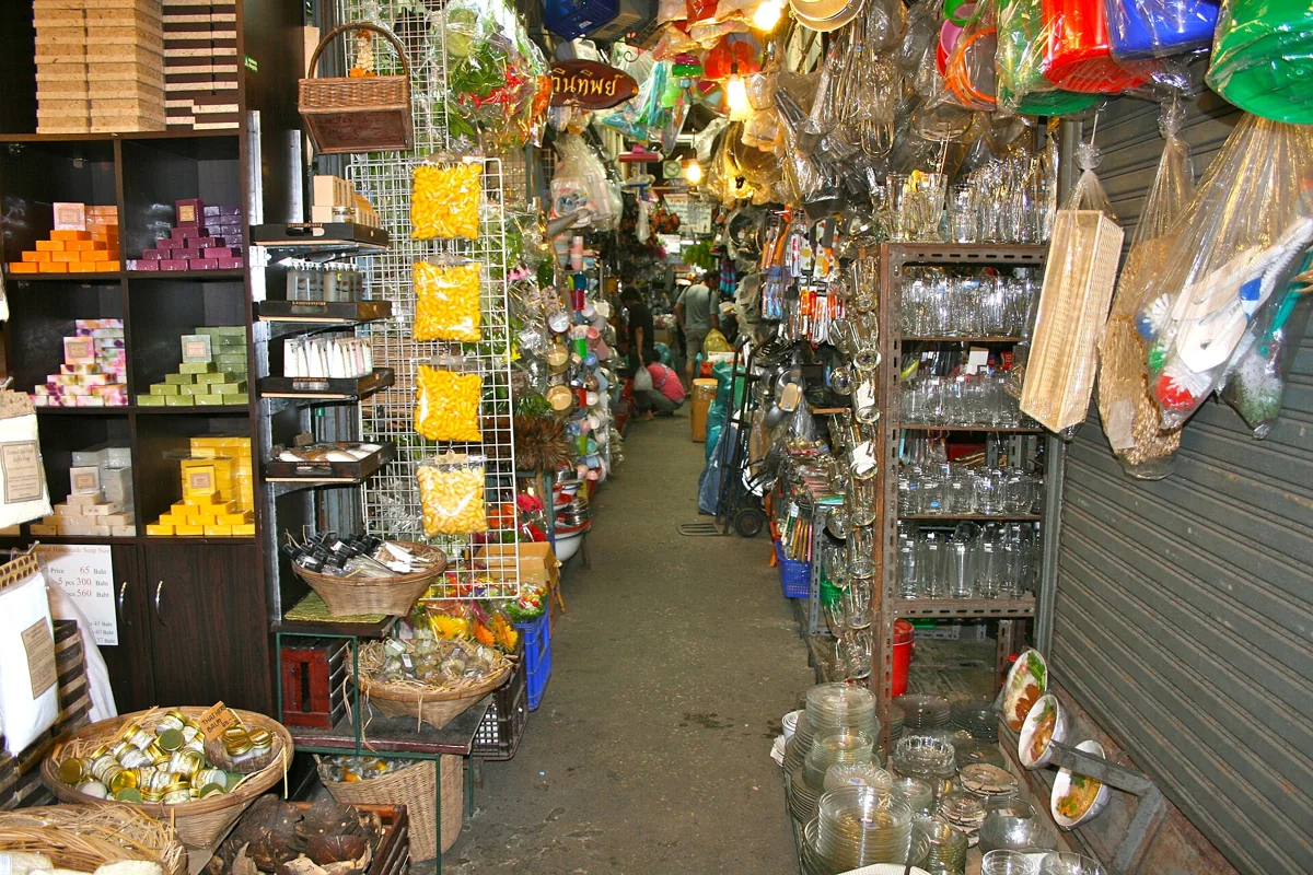 Colourful merchandise lining a narrow aisle at Chatuchak Weekend Market