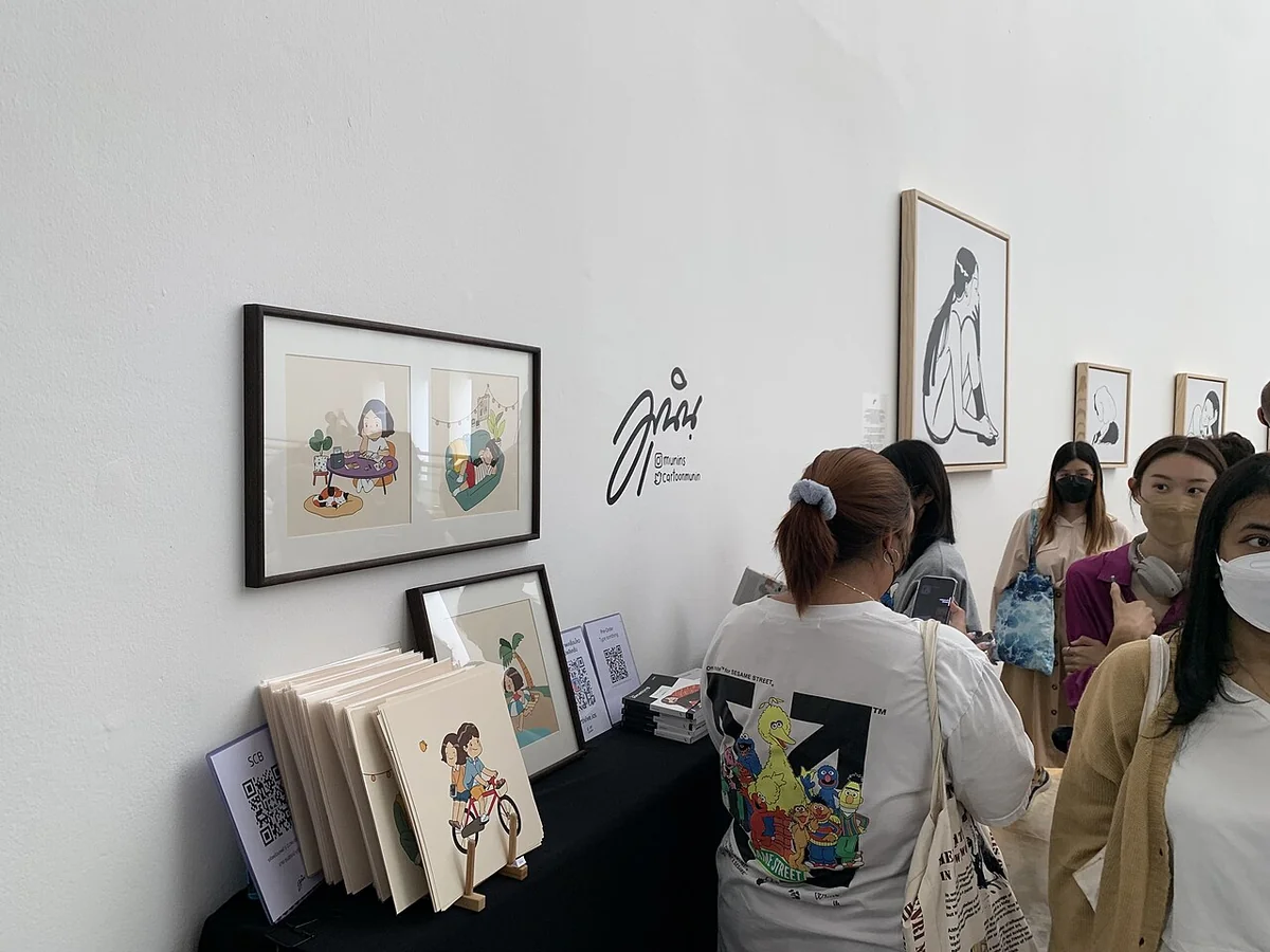 Visitors browsing illustrated books and prints at Bangkok Illustration Fair 2022